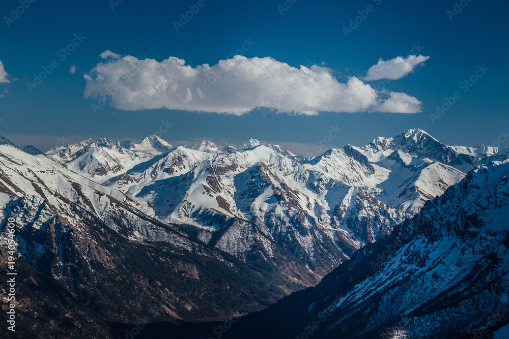 Mountains landscape. Caucasian mountain ridge with snow caps, Arkhyz, Russia