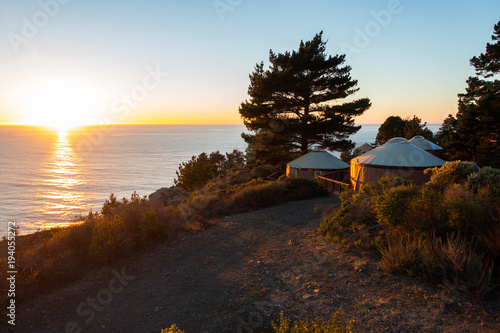 Yurts/tents at sunset at coastline/ocean in Big Sur, California