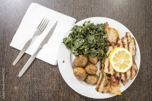 Mixed meat with spinach and potatoes