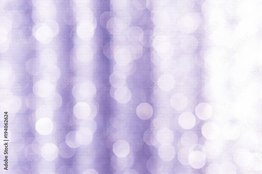 Fototapeta premium Abstract blurred light bokeh on purple background, festive season concept background