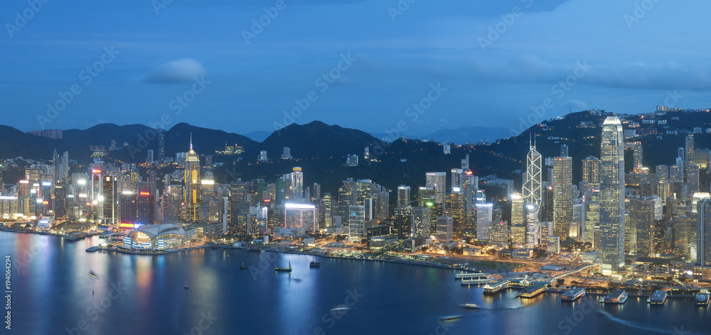 Fototapeta premium Panorama view of Victoria Harbor of Hong Kong city at dusk