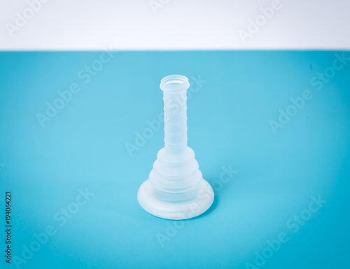 external condom catheter used in patient care isolated on blue table