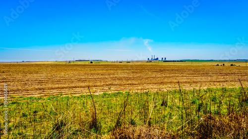 Coal fired powerstation in the middle of the wide open farmland along the R39 in the Vaal River region of southern Mpumalanga province in South Africa photo