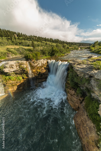  Lundbreck Falls in southwest Alberta  Canada with railway bridge behind  high angle portrait oriented view 
