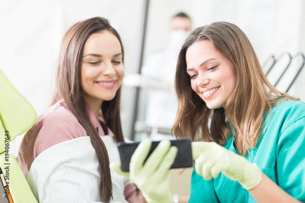Dentist and patient in dentist office Dentist and patient in dentist office