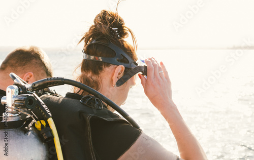 Woman diver preparing to dive, close up