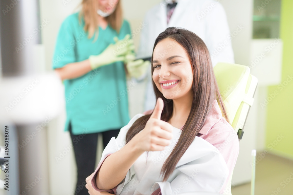 Happy female patient at the dental office Happy female patient at the dental office