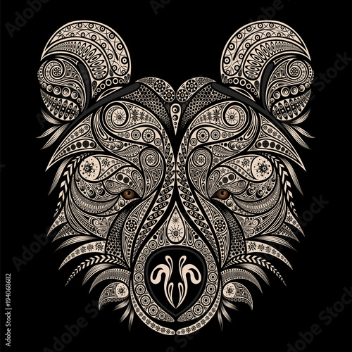 The head of a bear. Vector drawing of an animal from vintage patterns