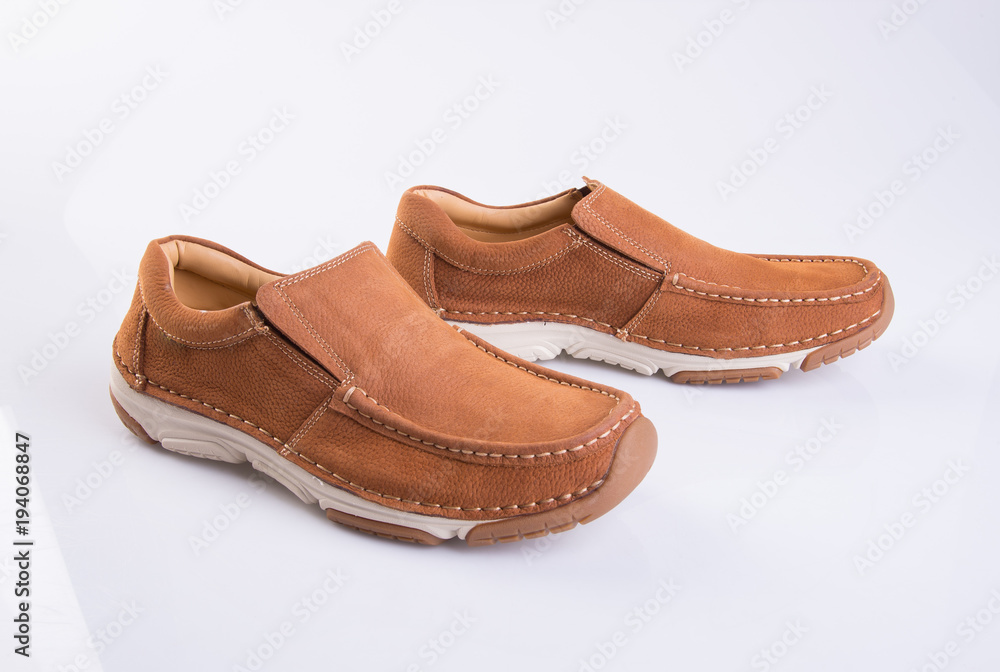 shoe or brown color men's shoes on a background.