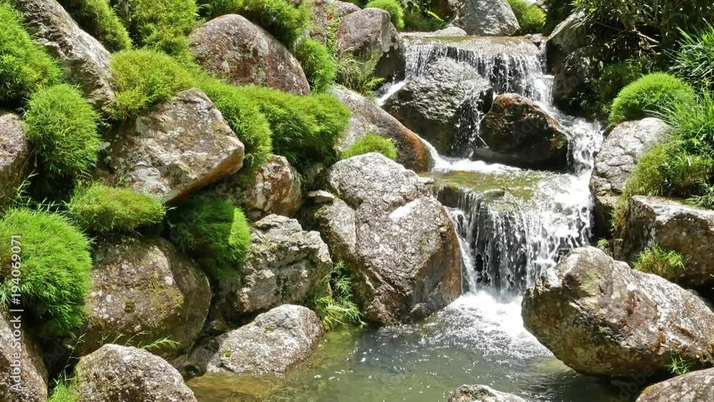Stream running over mossy rocks Stream running over mossy rocks