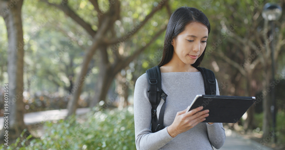 Fototapeta premium Woman use of tablet computer at outdoor