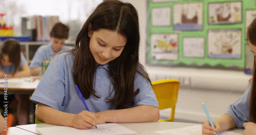 4K Happy elementary school children drawing at communal tables in classroom. Slow motion 4K Happy elementary school children drawing at communal tables in classroom. Slow motion