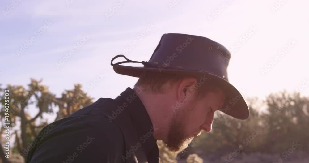 American Cowboy Spits on ground - close up on face American Cowboy Spits on ground - close up on face
