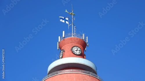 National flag of Finland on top of the old water tower. photo