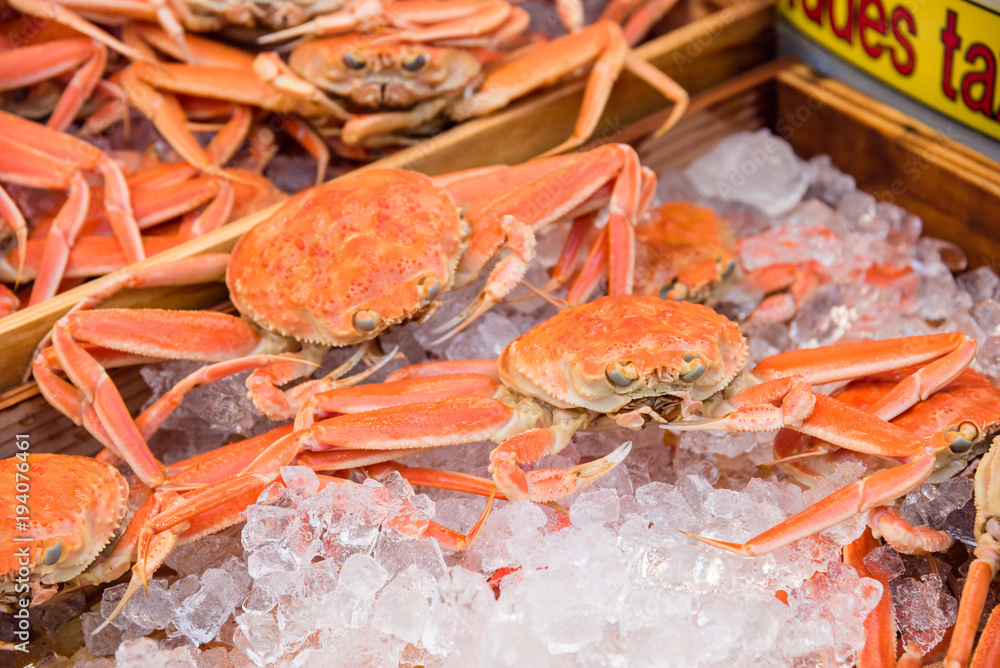 Fresh crabs on ice at kuromon ichiba market in Osaka,Japan Fresh crabs on ice at kuromon ichiba market in Osaka,Japan