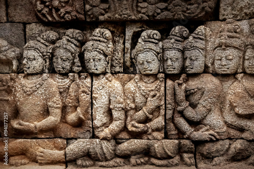 Ancient bas-reliefs on the walls of the Borobudur temple. Indonesia. Java is an island.