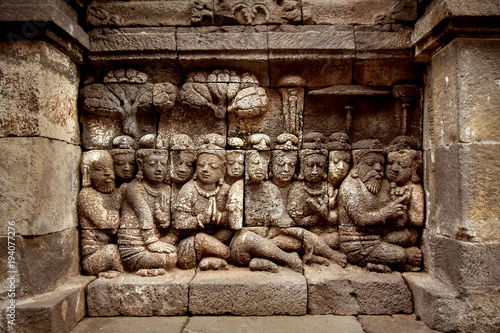 Ancient bas-reliefs on the walls of the Borobudur temple. Indonesia. Java island.