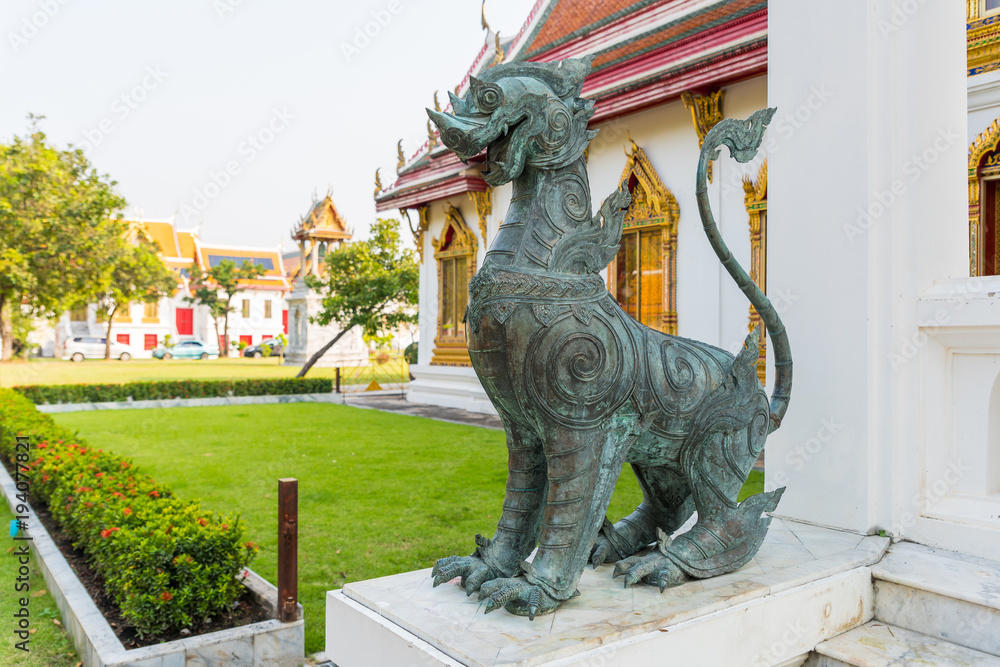Singha or the lion statue in front of Thai temple represent the guardian who protect the temple from the evil