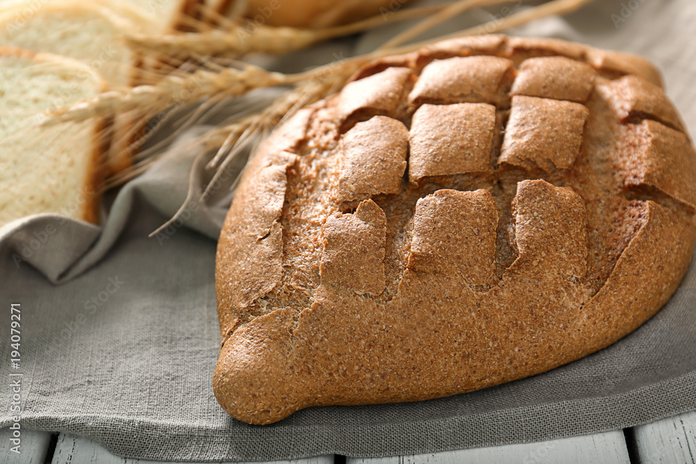 Loaf of freshly baked bread on table Loaf of freshly baked bread on table