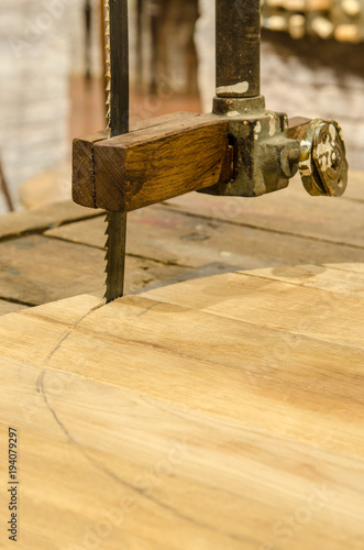 Сarpentry saw on wood.