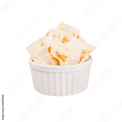 Ruddy pieces tortillas in white ceramics bowl isolated on white background. Fast food template for menu, advertising, cover.