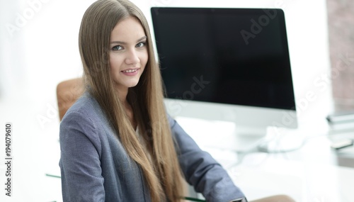 female office employee sitting at a Desk