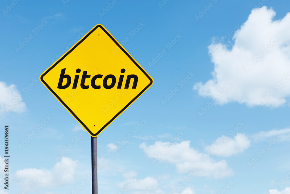 Yellow signboard with bitcoin word Yellow signboard with bitcoin word