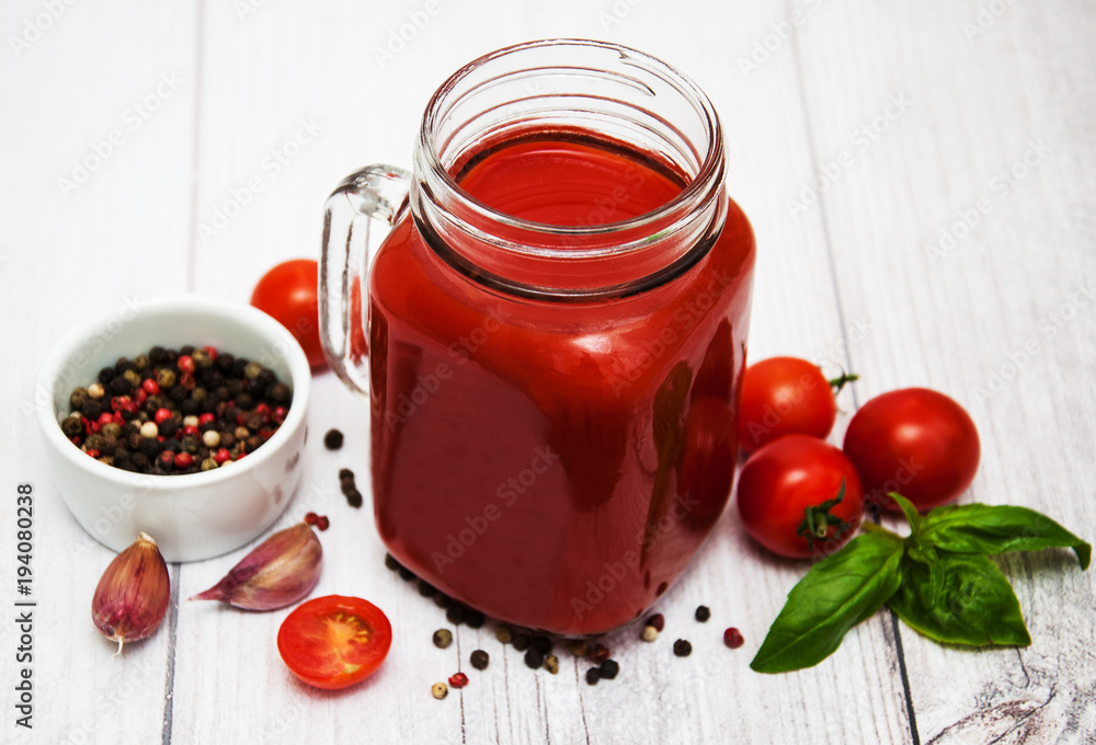 Jars with tomato juice Jars with tomato juice
