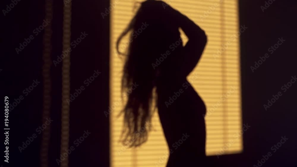 Shadow of girl playing with hair Shadow of girl playing with hair