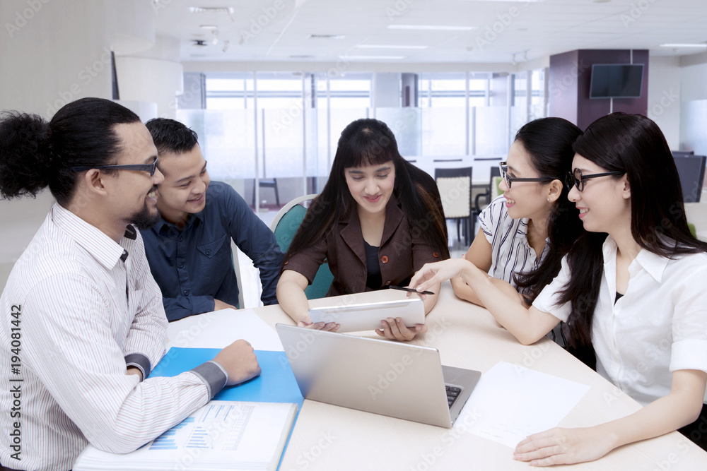 Business people having a discussion in an office meeting Business people having a discussion in an office meeting