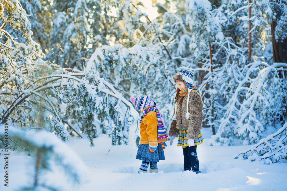 The kids in the winter woods.