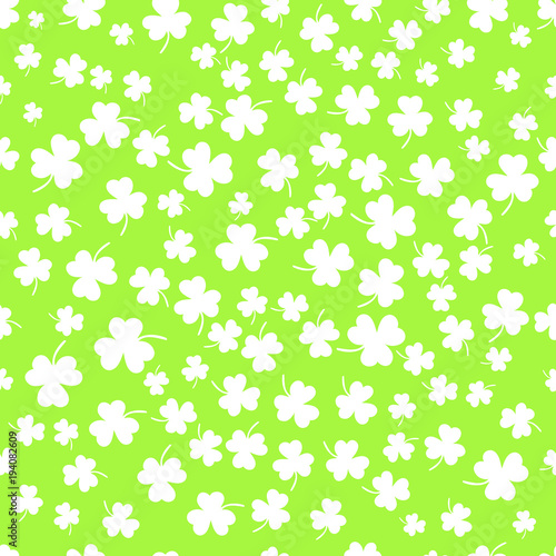 Seamless clover leaf flat design green pattern falling on dark green background vector illustration