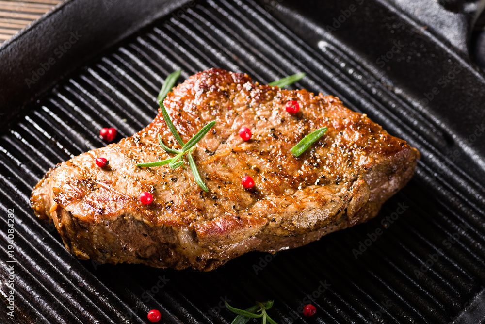 Beef steak with pepper on grill pan