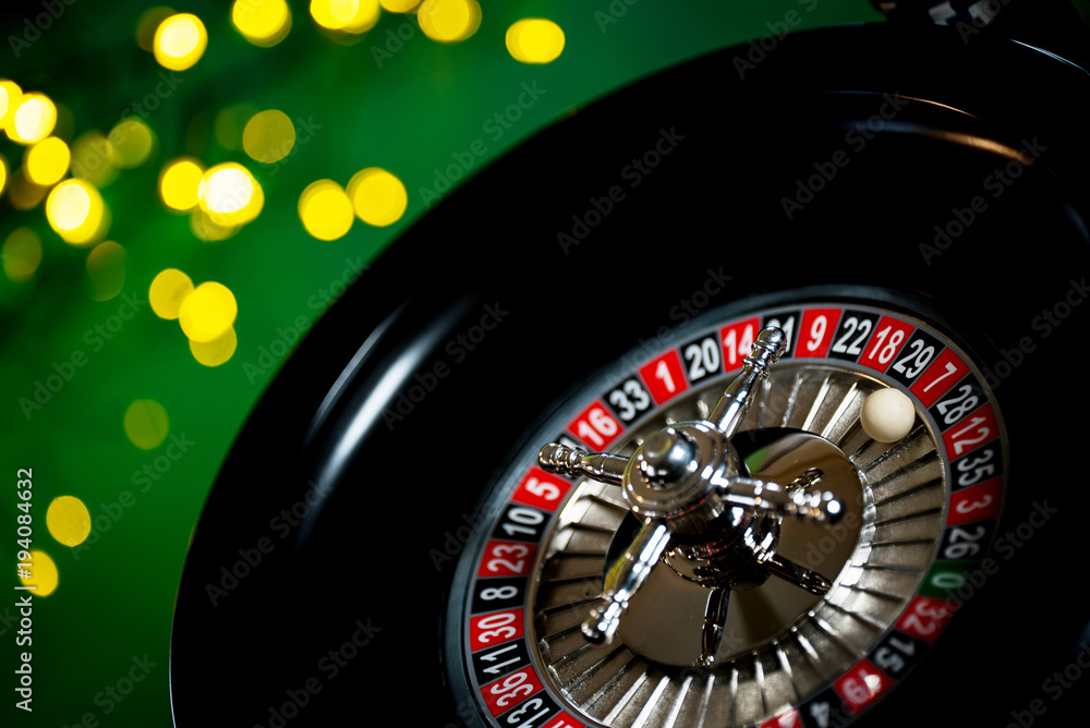 High contrast image of casino roulette and poker chips High contrast image of casino roulette and poker chips