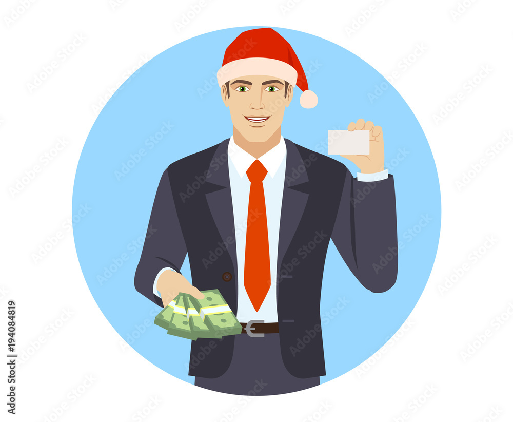 Businessman in Santa hat with money showing the business card Businessman in Santa hat with money showing the business card