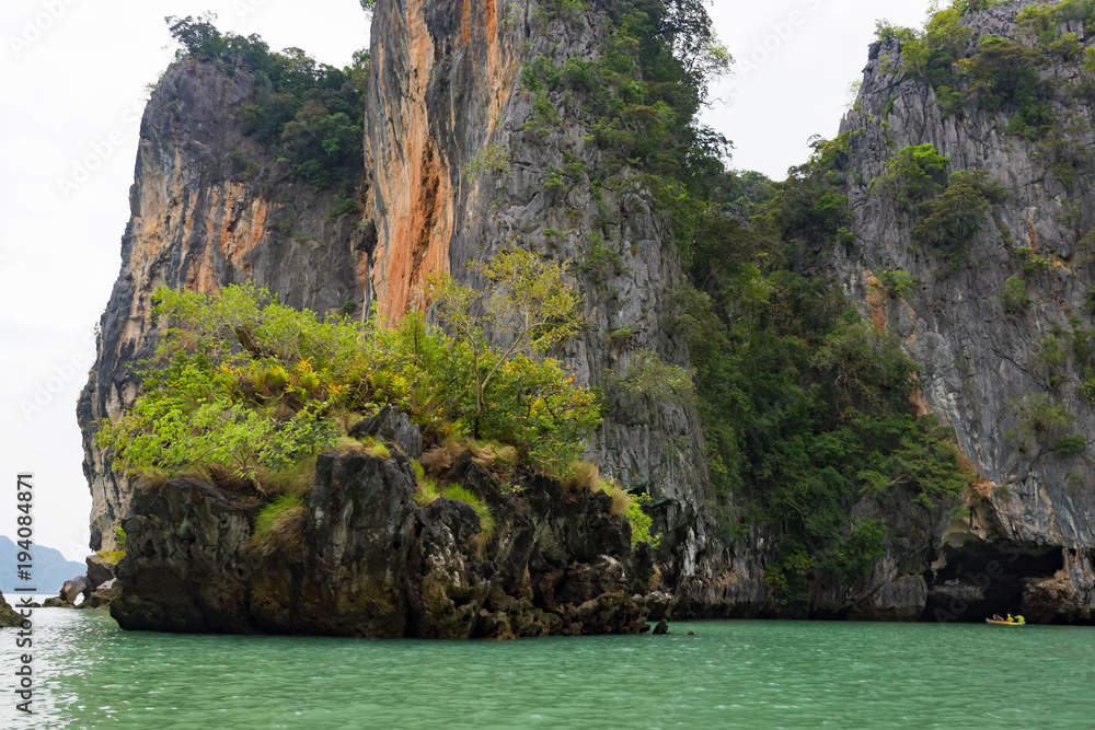 Thailand, Phuket, 2017 - kayaking under sea rocks