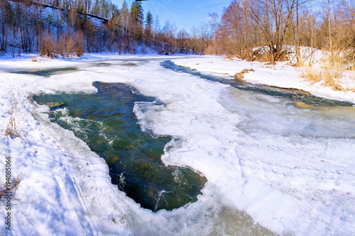 A large polynya on a small river in the Sunny Spring day photo