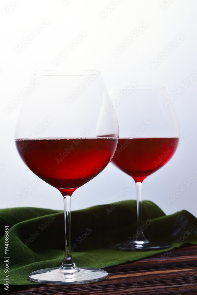 Two glasses of red wine. 