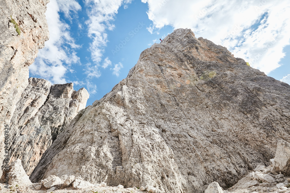 Mountain climber rappelling down cliff Mountain climber rappelling down cliff