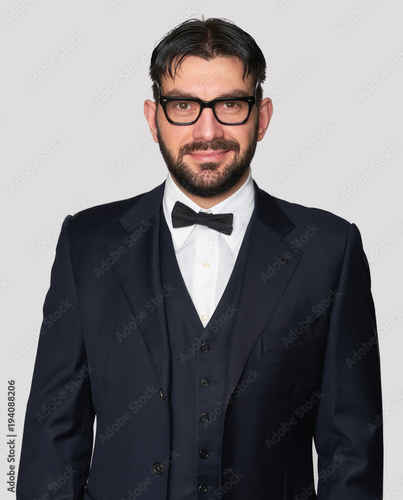 happy handsome man wearing classic suit and bow tie happy handsome man wearing classic suit and bow tie
