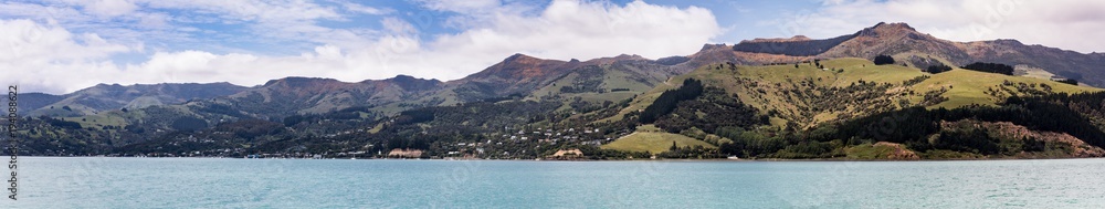 A panoramic view of Akaroa, on the Banks Peninsula New Zealand from the sea