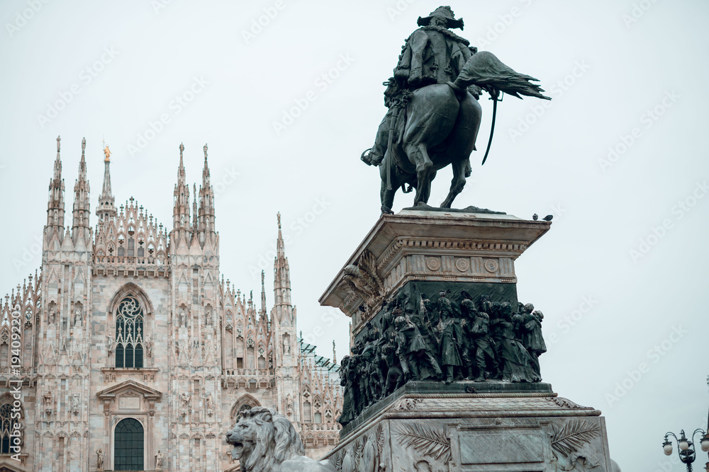 Milan Duomo cathedral church main square with statue knight