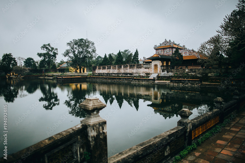 beautiful calm pond and ancient oriental architecture in Hue, Vietnam beautiful calm pond and ancient oriental architecture in Hue, Vietnam