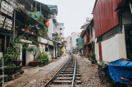 HANOI, VIETNAM - 03 JANUARY, 2018: empty railroad between buildings in Hanoi, Vietnam