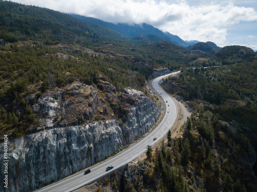 Aerial drone view of Sea to Sky hwy during a vibrant sunny summer day. Taken near Squamish and Whistler, North of Vancouver, BC, Canada.