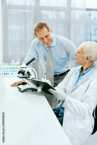 Scientific Team Working In Modern Laboratory. photo