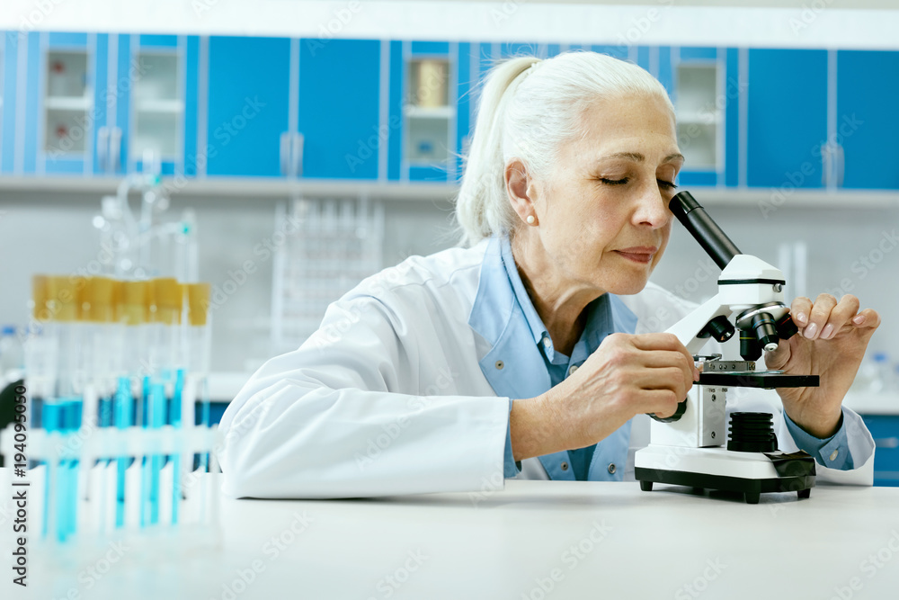 Laboratory. Female Scientist Analyzing, Looking In Microscope Laboratory. Female Scientist Analyzing, Looking In Microscope