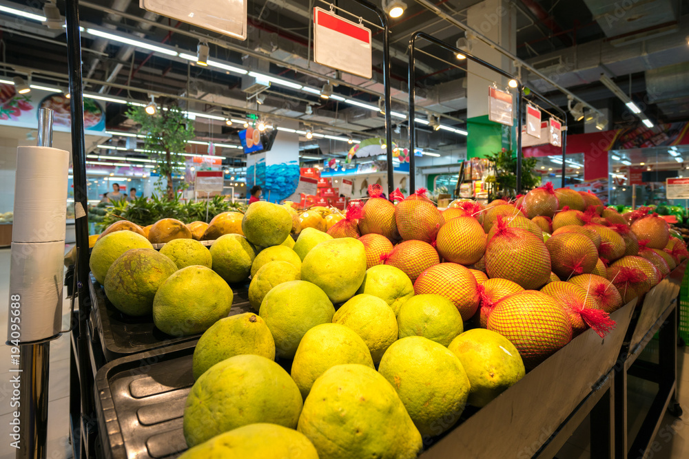 Fresh fruits on shelf in supermarket.