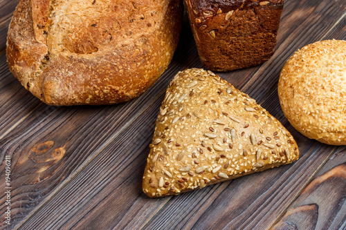 assortment of baked bread on wood table