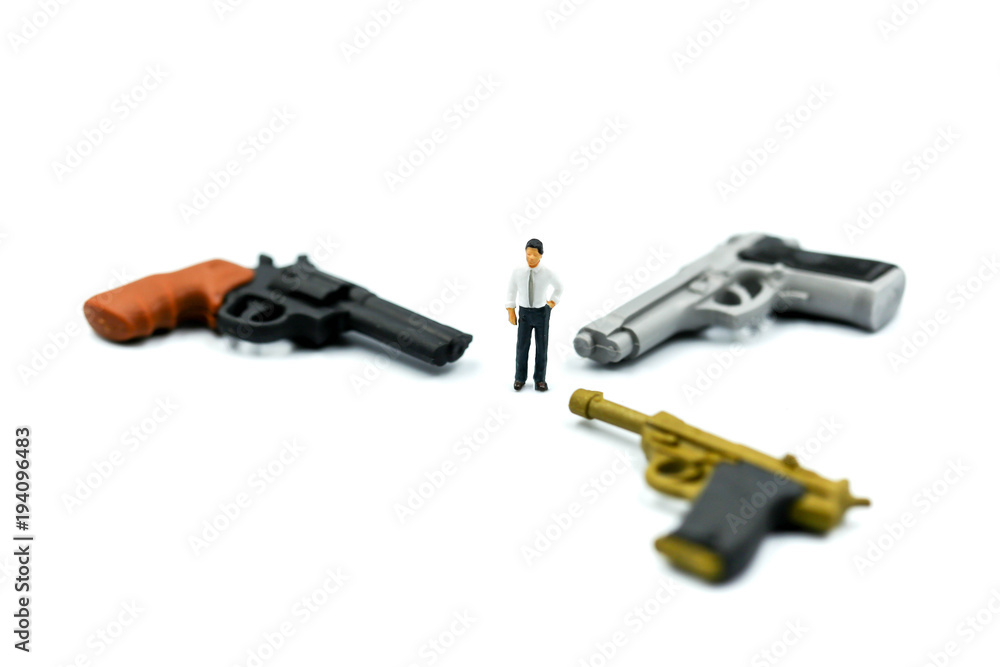 Miniature people : Businessman with a gun.